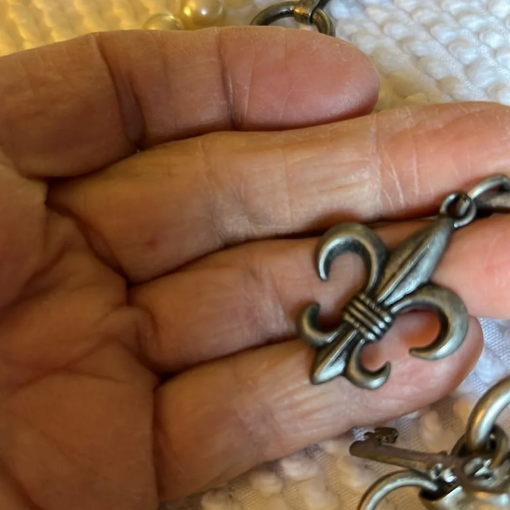 Women’s double chain belt. One of metal objects and the second chain of pearls.